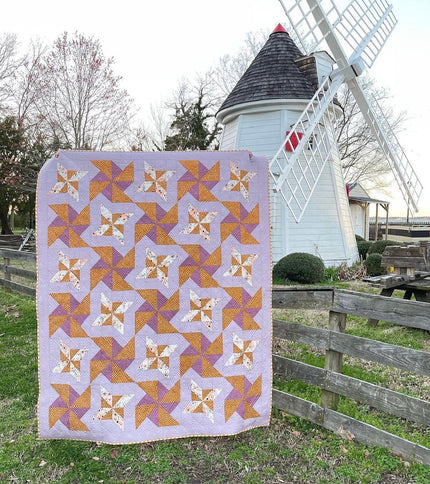 Lovely Pinwheels quilt with flannel backing (66” x 72”)