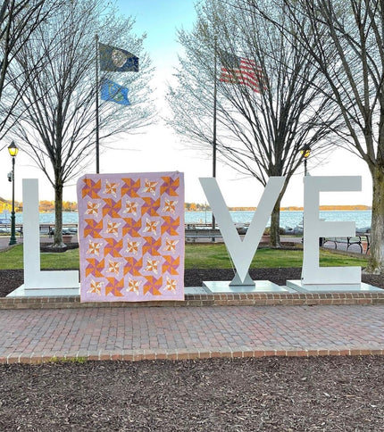 Lovely Pinwheels quilt with flannel backing (66” x 72”)