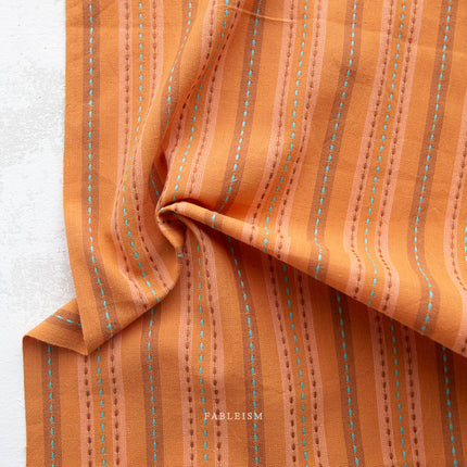 Canyon Springs - Stitch Stripe Rust - sold by the half yard
