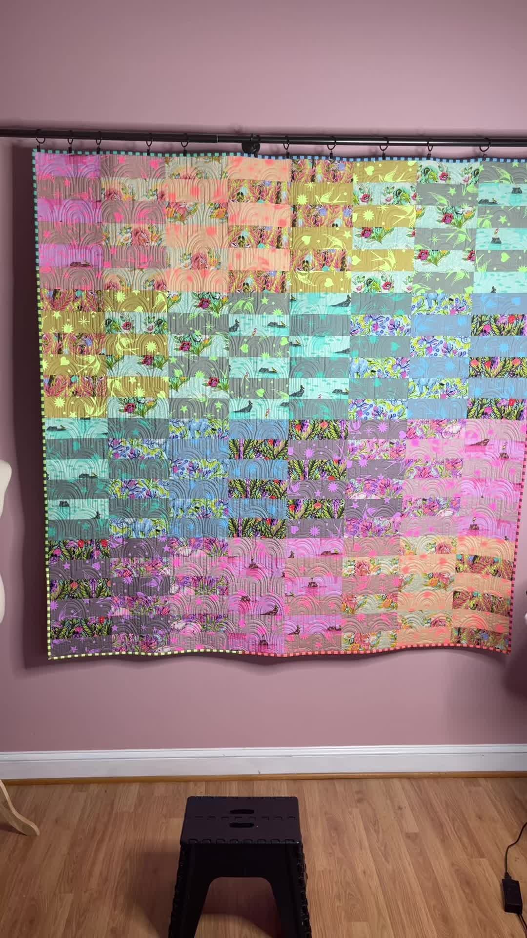 Finished quilt reveal made with the Tula Pink Everglow line